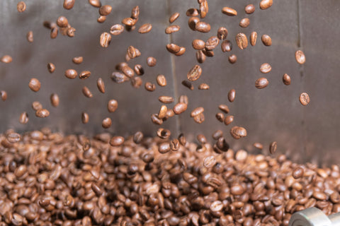 coffee beans in a cooling tray of a roaster